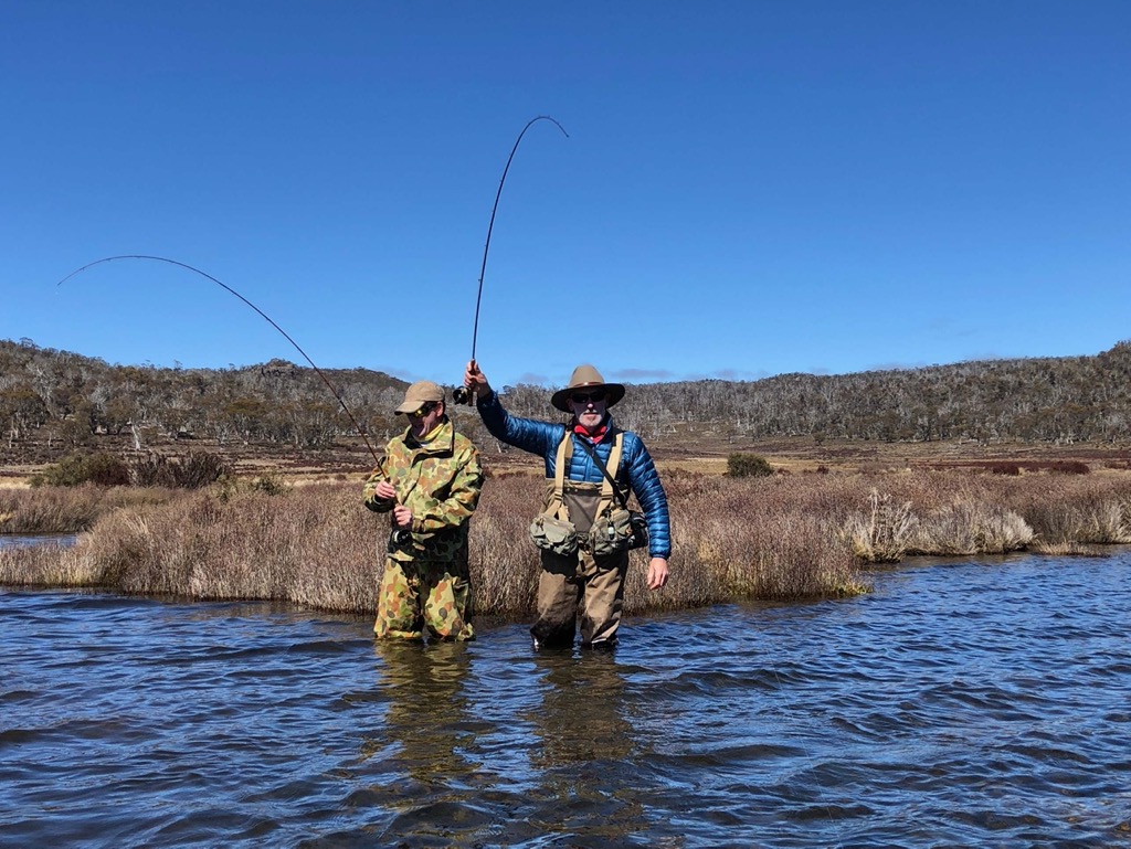 Nick and Nick with a brown trout and a brown trout, on Jeff Wagner bamboo rods